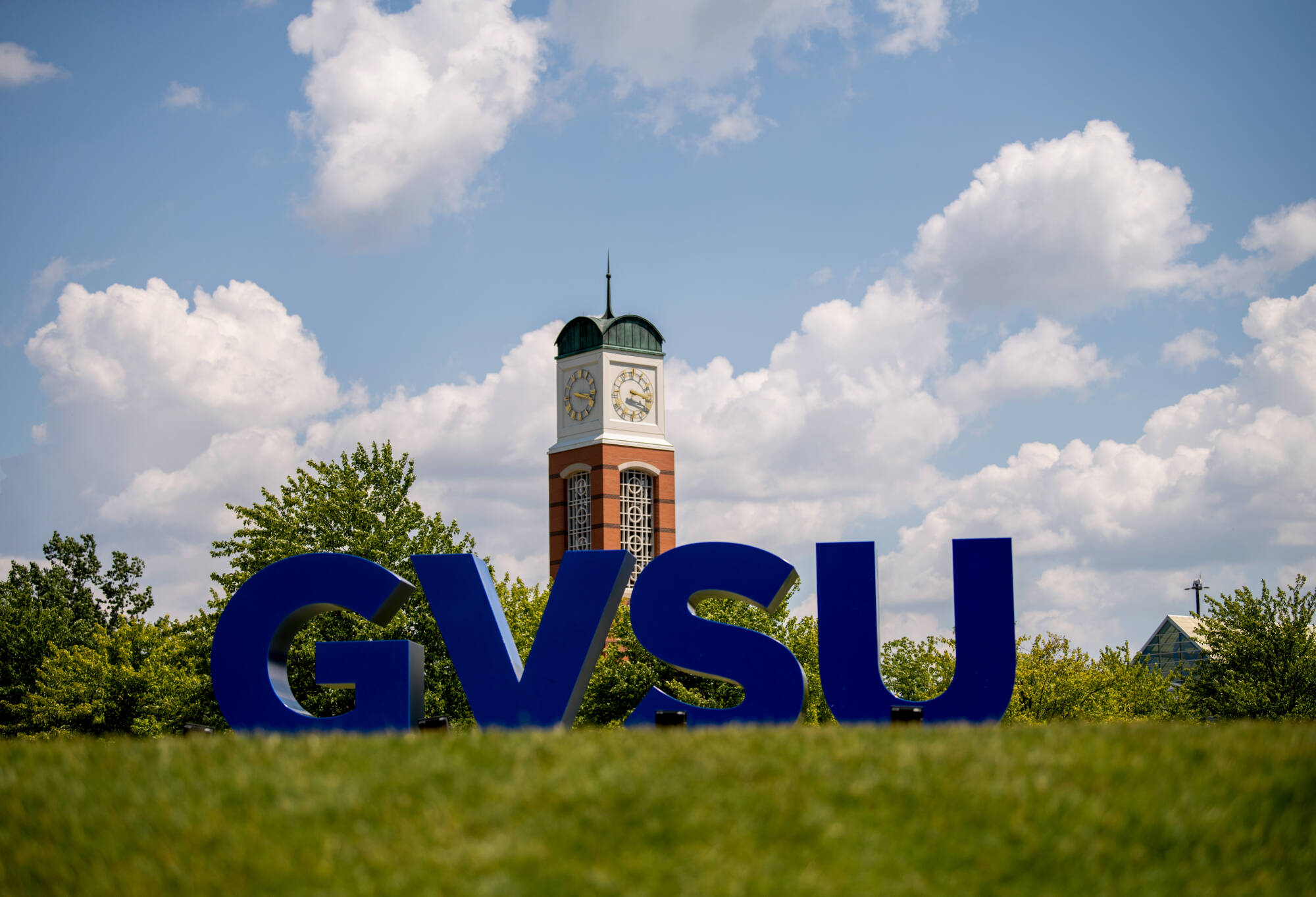 GVSU letters in front of Carillon Clock Tower